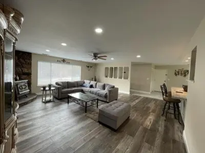 a living room with a couch and a table at Beautiful 3 bedroom home located near Yosemite in Oakhurst