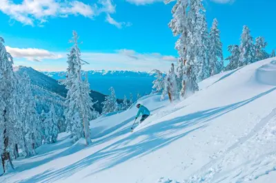 a person is skiing down a snow covered slope at Maison de Montagne in Incline Village