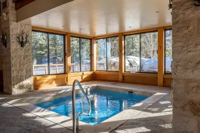 a swimming pool in a house with a porch at Obsidian 300 in Mammoth Lakes
