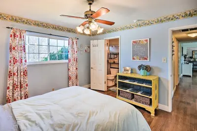 a bedroom with a bed and a ceiling fan at 1 Mi to Main Street Sutter Creek Poolside Oasis! in Sutter Creek