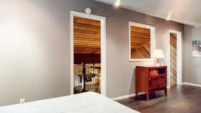 a bedroom with a bed and a desk and a window at Snowcreek I #28 condo in Mammoth Lakes