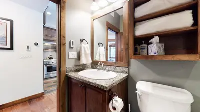 a bathroom with a sink and a toilet at Woodwinds #1271 townhouse in Mammoth Lakes