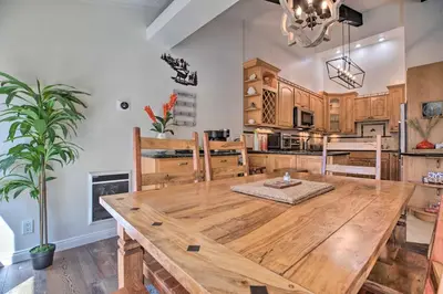 a dining room with a large wooden table in a kitchen at Epic Mammoth Lakes Getaway with Shared Pool, Hot Tub in Mammoth Lakes