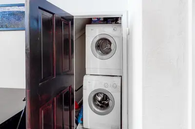 a washer and dryer sitting next to a door at Back Country Basecamp in Stateline
