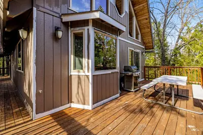 a porch of a house with a wooden deck at Majestic Mountain in Dorrington