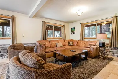 a living room with a brown couch and chairs at Majestic Mountain in Dorrington
