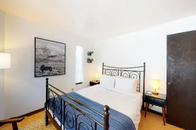 a bedroom with a bed with a blue and white bedspread at Overlook Nook in Stateline