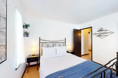 a bedroom with a bed and two lamps on tables at Overlook Nook in Stateline