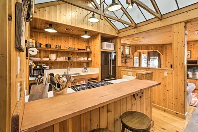 a kitchen with wooden walls and a large counter top at Less Than 1 Mi to Heavenly Lifts Tahoe Area Townhome! in Stateline