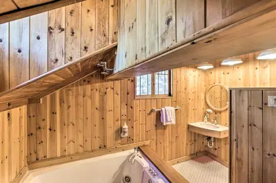 a bathroom with wooden walls and a tub and sink at Less Than 1 Mi to Heavenly Lifts Tahoe Area Townhome! in Stateline