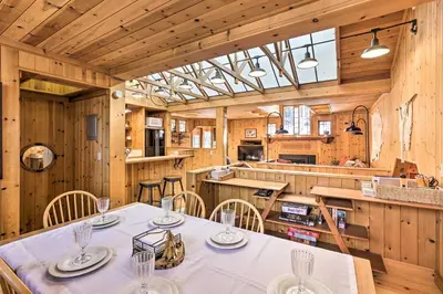 a kitchen and dining room with a table and chairs at Less Than 1 Mi to Heavenly Lifts Tahoe Area Townhome! in Stateline