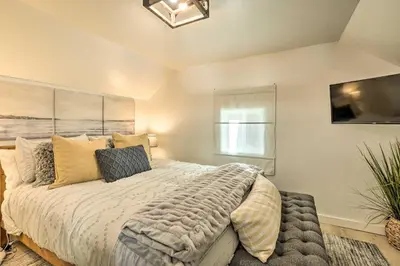 a bedroom with a large bed in a room at Walk to Lake Tahoe Cozy Zephyr Cove Cabin! in Zephyr Cove