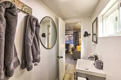 a bathroom with a sink and a mirror at Walk to Lake Tahoe Cozy Zephyr Cove Cabin! in Zephyr Cove