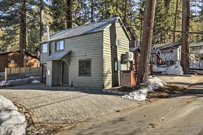 a small house on the side of a road at Walk to Lake Tahoe Cozy Zephyr Cove Cabin! in Zephyr Cove