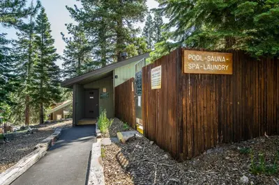 a building with a sign that reads pool service spa laughter at Hidden Valley Village #103 nicely updated 1 bedroom 1 bathroom condo short 10 min walk from Village in Mammoth Lakes