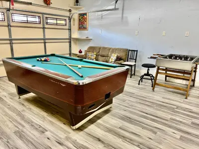 a billiard room with a pool table in it at DT Reno - 4BR Home with Patio, BBQ Grill, Games Room in Reno