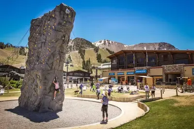 a group of people playing on a rock wall at Snowcreek 27 in Mammoth Lakes