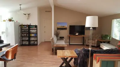 a living room filled with furniture and a flat screen tv at Explore Amador and Calaveras County. in West Point