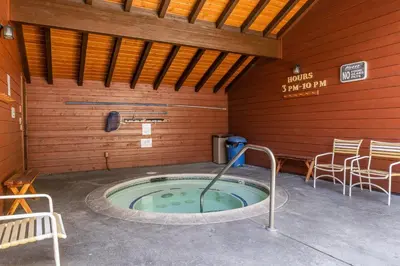 a hot tub in a sauna with chairs and a table at Spacious Winterset 26 2 Bedrm Plus Loft 3 Full Bathrm Townhome Sleeps 8 Steps to Free Town Shuttle in Mammoth Lakes