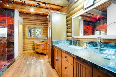 a bathroom with two sinks and a tub at The Cub Inn in Groveland