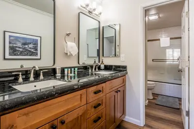 a bathroom with two sinks and a toilet at Ski in Ski Out 3 Bedrm 3 Bathrm fully remodeled Sierra Megeve Condo Steps to Canyon Lodge Sleeps 8 in Mammoth Lakes