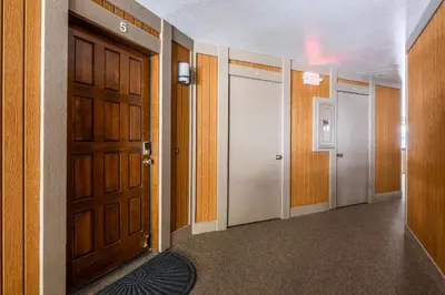 an empty hallway with a door and a room with at Ski in Ski Out 3 Bedrm 3 Bathrm fully remodeled Sierra Megeve Condo Steps to Canyon Lodge Sleeps 8 in Mammoth Lakes