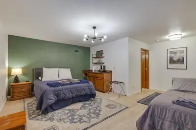 a bedroom with two beds and a dresser in it at Hikers Escape Home Near Beach, Golf and Yosemite in Groveland