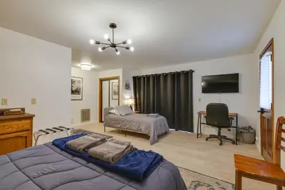 a bedroom with a bed and a desk and a television at Hikers Escape Home Near Beach, Golf and Yosemite in Groveland
