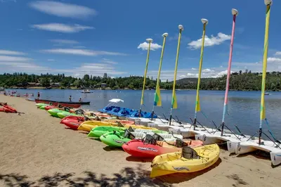 a row of kayaks lined up on a beach at Fun In The Sun Cabin in Groveland
