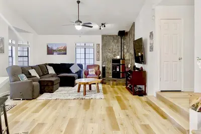 a living room with a couch and a table at Fun In The Sun Cabin in Groveland