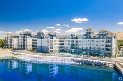 an aerial view of a resort with a body of water at Chic Apt w Jacuzzi, Pool, BBQ, & Mountain Views in Sparks