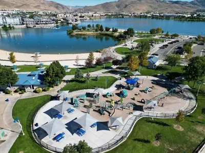 an aerial view of a park next to a lake at Chic Apt w Jacuzzi, Pool, BBQ, & Mountain Views in Sparks