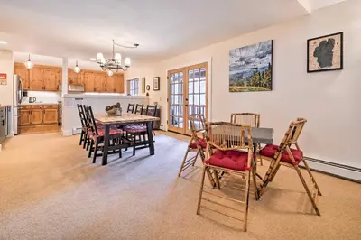 a kitchen and dining room with a table and chairs at Furnished Deck Cabin on Northstar Shuttle Route! in Truckee