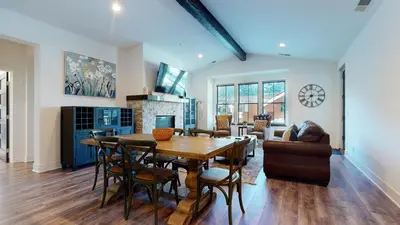 a dining room and living room with a table and chairs at Snowcreek VII #1403 condo in Mammoth Lakes