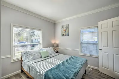 a bedroom with a bed and two windows at Pet-Friendly Sacramento Home about 5 to Downtown! in Sacramento