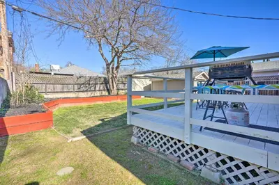 a deck with a grill and an umbrella at Pet-Friendly Sacramento Home about 5 to Downtown! in Sacramento