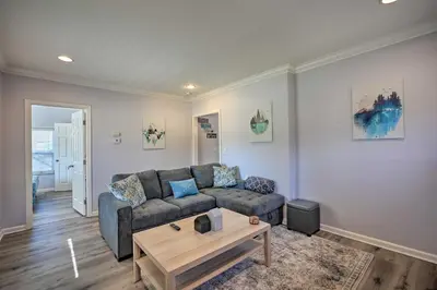 a living room with a couch and a coffee table at Pet-Friendly Sacramento Home about 5 to Downtown! in Sacramento