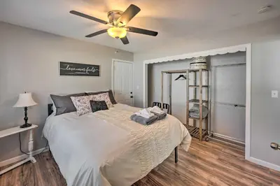 a bedroom with a bed with a ceiling fan at Authentic Escape at the Exact Center of CA! in North Fork