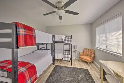 a bedroom with two bunk beds and a ceiling fan at Authentic Escape at the Exact Center of CA! in North Fork