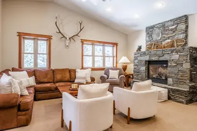 a living room with a couch and a fireplace at Newly Updated Red Slate 4 is a 4 Bedrm 3 full Bathrm Townhome Close to Canyon Lodge That Sleeps 10 in Mammoth Lakes