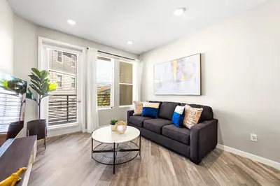 a living room with a couch and a table at Chic Apt with Jacuzzi, Pool Nr Casino & Shopping in Sparks