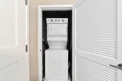 a refrigerator in a kitchen with a door open at Chic Apt with Jacuzzi, Pool Nr Casino & Shopping in Sparks