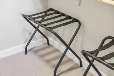 a black chair sitting next to a wall at Chic Apt with Jacuzzi, Pool Nr Casino & Shopping in Sparks