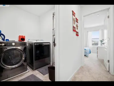 a kitchen with a washing machine and a washer at Madera lovely home in Madera
