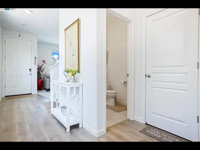 a bathroom with a toilet and a white door at Madera lovely home in Madera