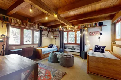 a living room with a bed and a couch at The Chalet in Zephyr Cove