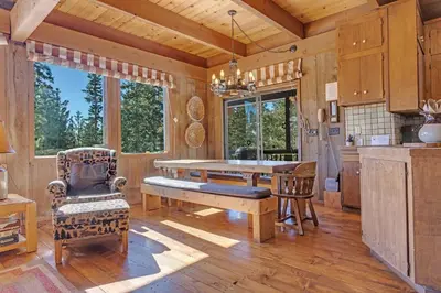 a kitchen with a dining room table and chairs at Overlooking Beautiful Bear Lake VH#318 in Bear Valley
