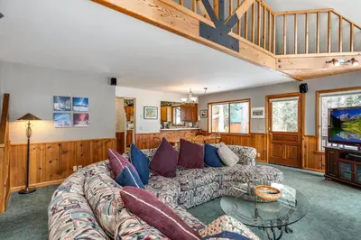 a living room with a couch and a tv at Spacious Cabin Sleeps up to 12 - Sky High #86 in Bear Valley