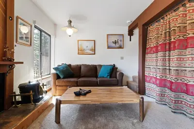 a living room with a couch and a coffee table at Comfortable Condo Great Location- Tamarack #12 in Bear Valley