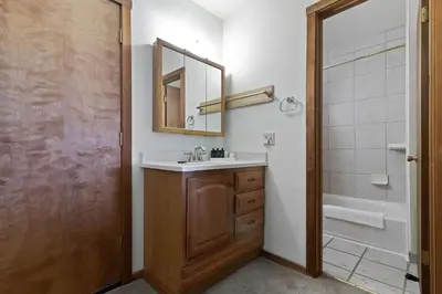 a bathroom with a sink and a mirror and a shower at Comfortable Condo Great Location- Tamarack #12 in Bear Valley
